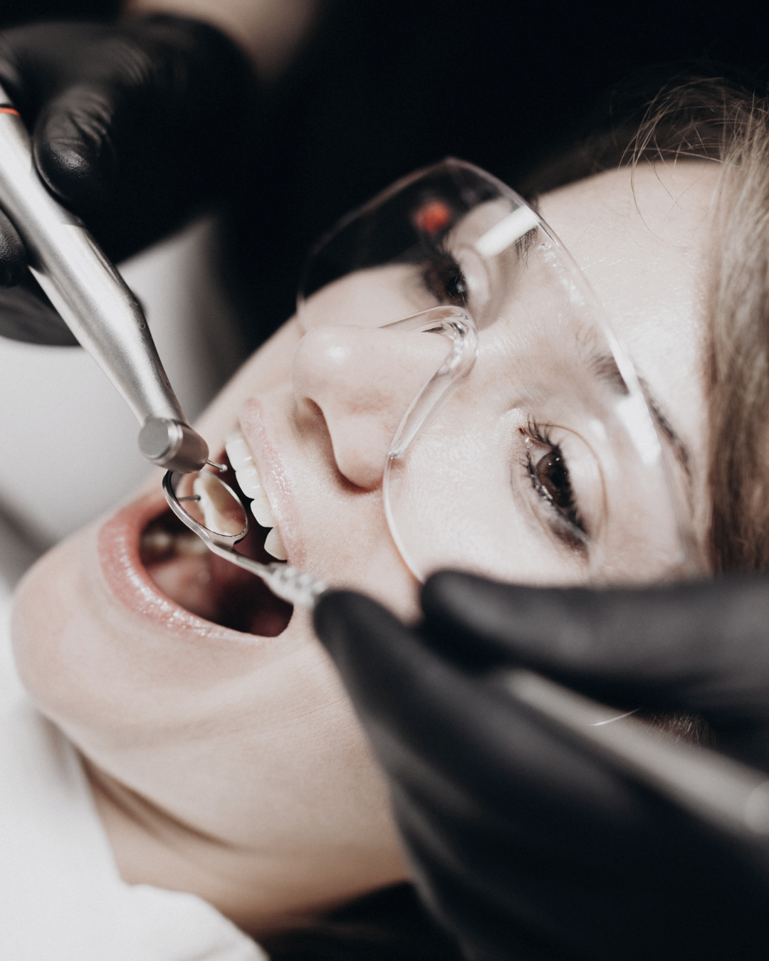 Dentist examining a patient's teeth during an appointment at Anzac Avenue Dental, Kallangur